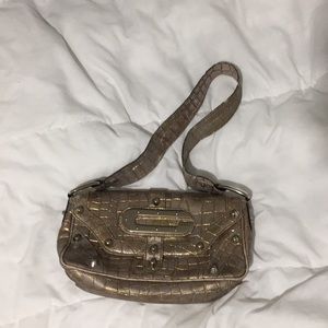 Gold, vintage-looking Guess purse